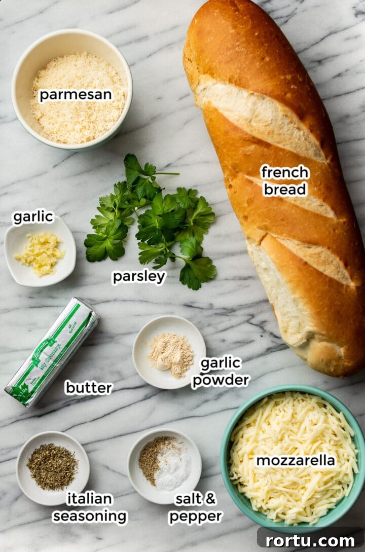 Indulgent Garlic Cheese Bread Recipe for Garlic Lovers 3 ingredients for cheesy garlic bread on a marble surface