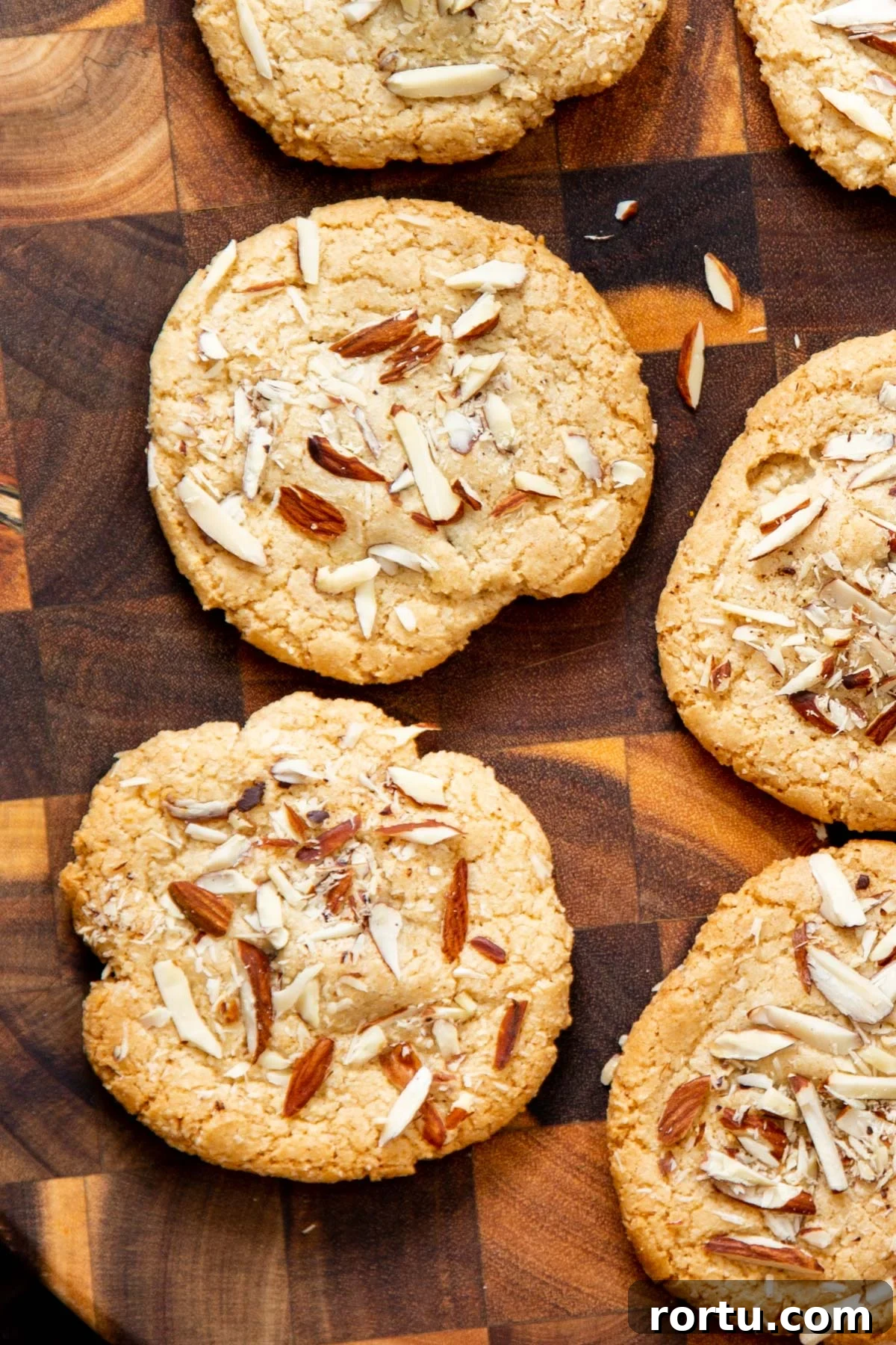 Gluten-Free Vegan Almond Joy Cookies Recipe 2 glutenfree almond joy cookies on a wooden chopping board