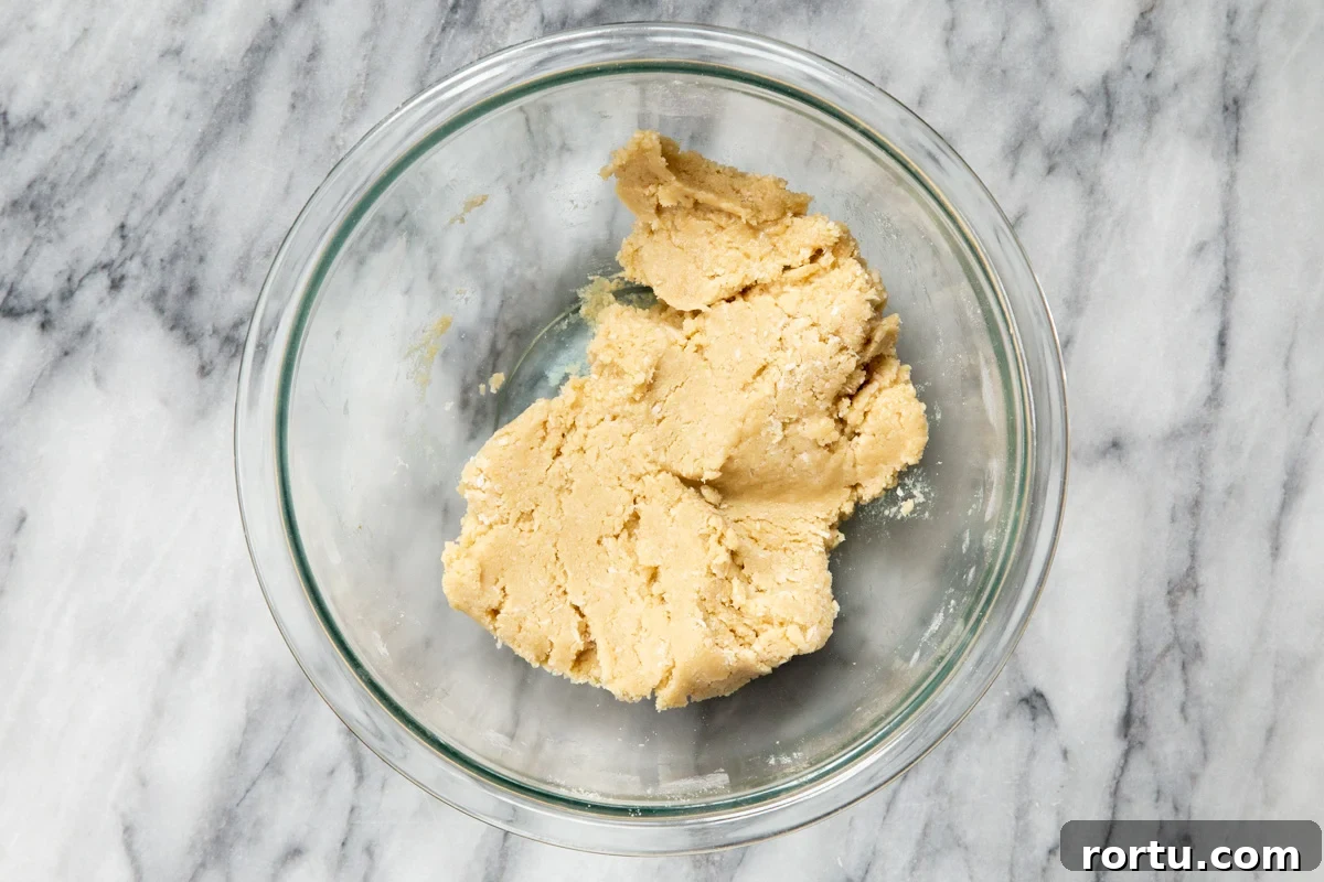 Gluten-Free Vegan Almond Joy Cookies Recipe 10 vegan almond joy cookie dough in a glass bowl