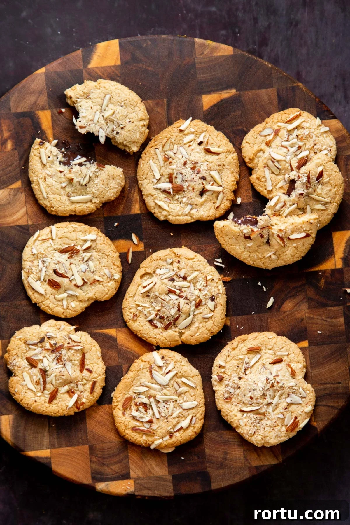 Gluten-Free Vegan Almond Joy Cookies Recipe 4 Almond Joy Cookies on a wooden chopping board