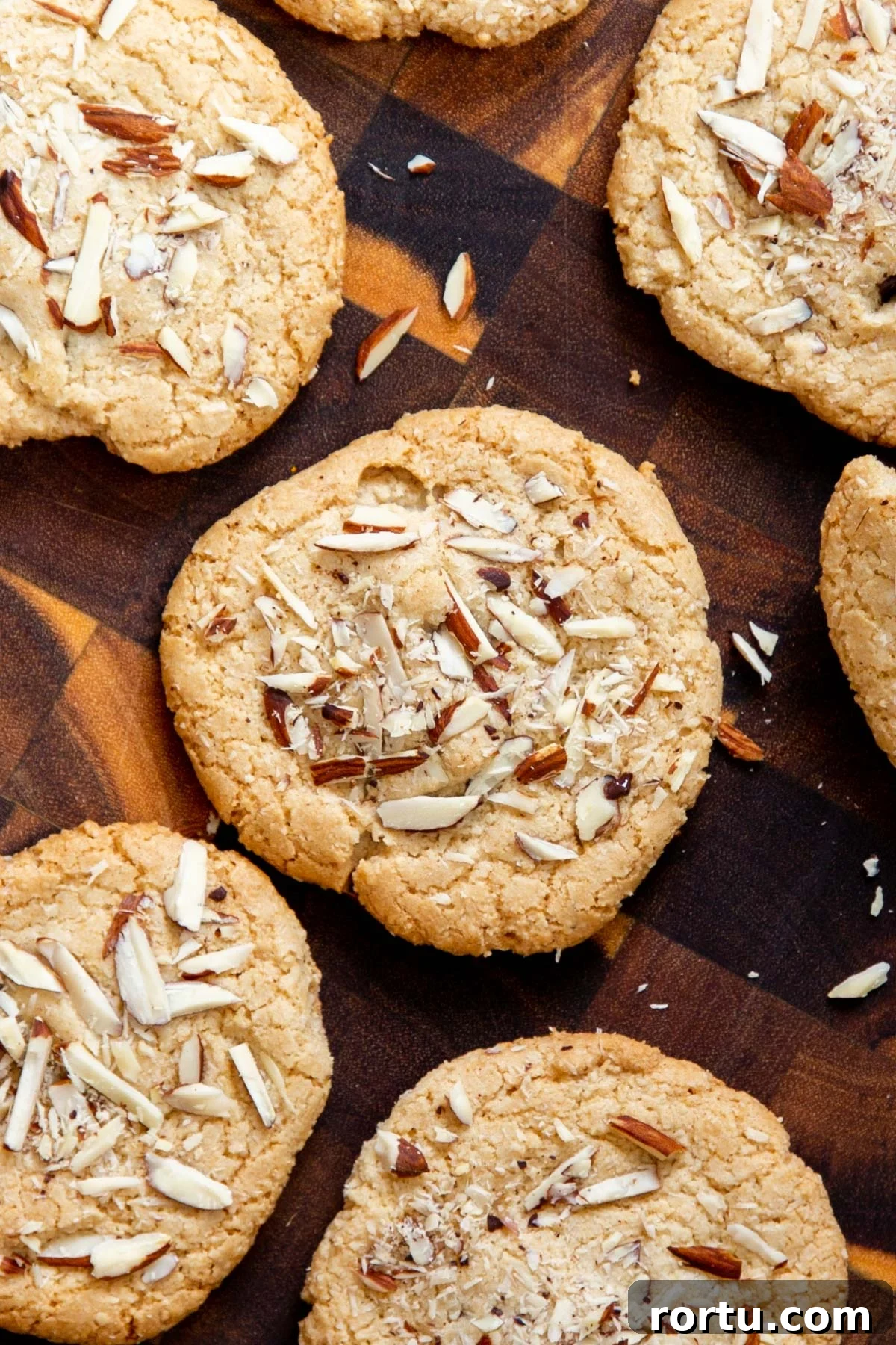 Gluten-Free Vegan Almond Joy Cookies Recipe 6 glutenfree vegan almond joy cookies on a wooden chopping board