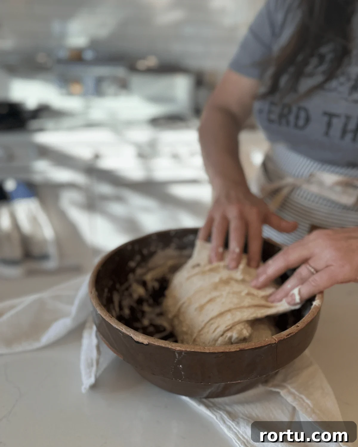 folding sourdough bread dough on another side