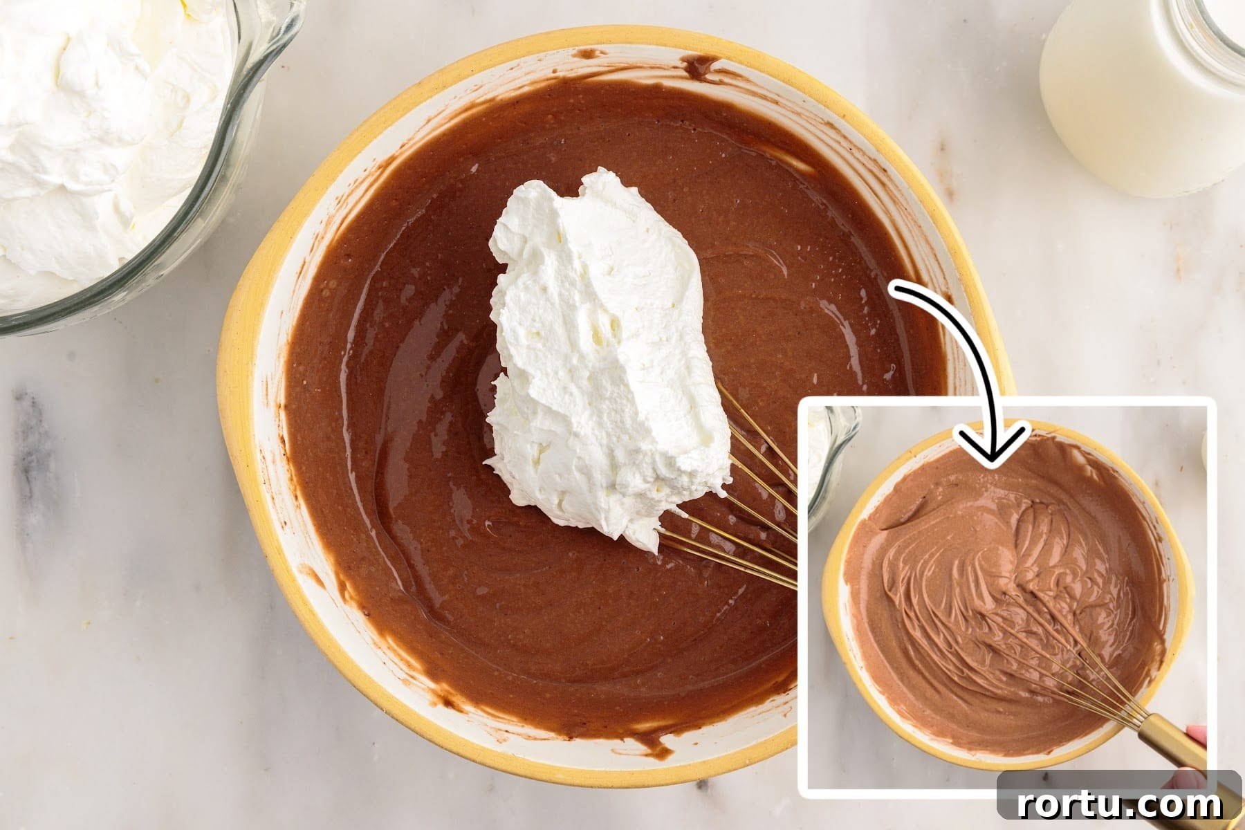 Whipped cream added to the chocolate pudding mixture and an image after it has been mixed together.
