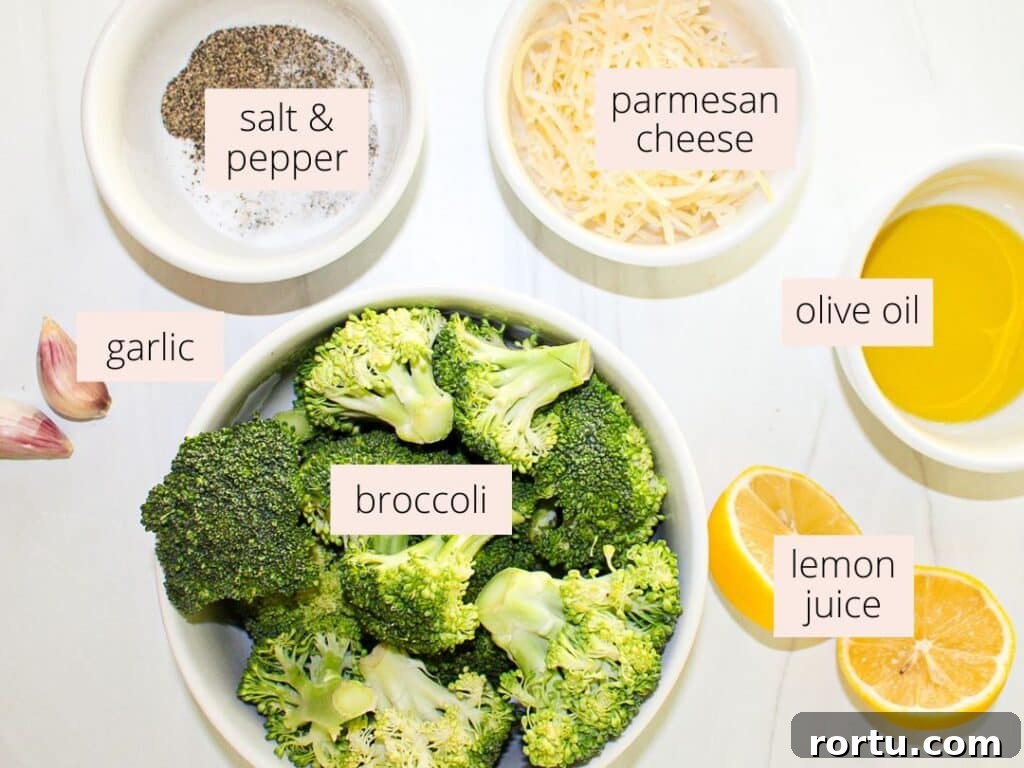 Crispy Smashed Broccoli with Parmesan and Garlic 3 Ingredients for smashed broccoli parmesan like broccoli, parmesan cheese, olive oil, lemon juice and garlic laid out on a countertop with labels.