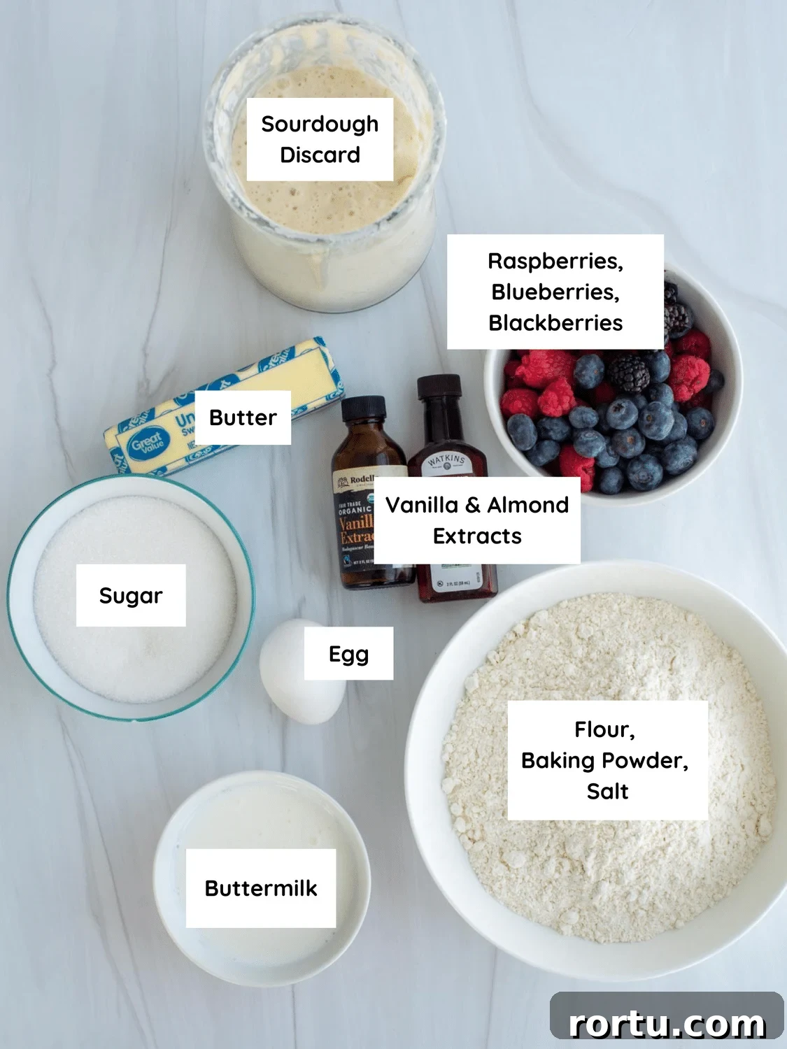 Ingredients labeled on a countertop for sourdough discard triple berry cake.