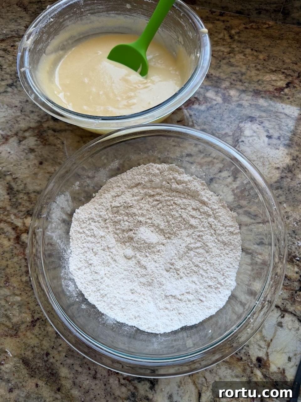 Wet and dry ingredients are mixed in separate bowls.