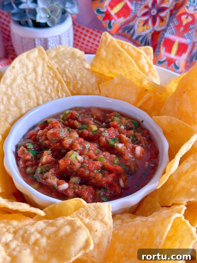 Chips and salsa in a serving bowl.