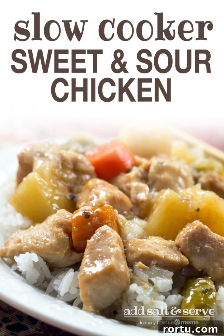 Chunks of cooked chicken, pineapple, carrots, and peppers served over white rice with text slow cooker sweet and sour chicken