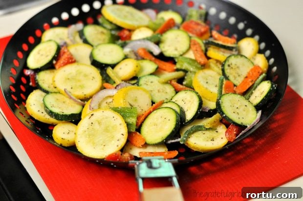 Veggies are placed into a BBQ-grill pan for cooking.
