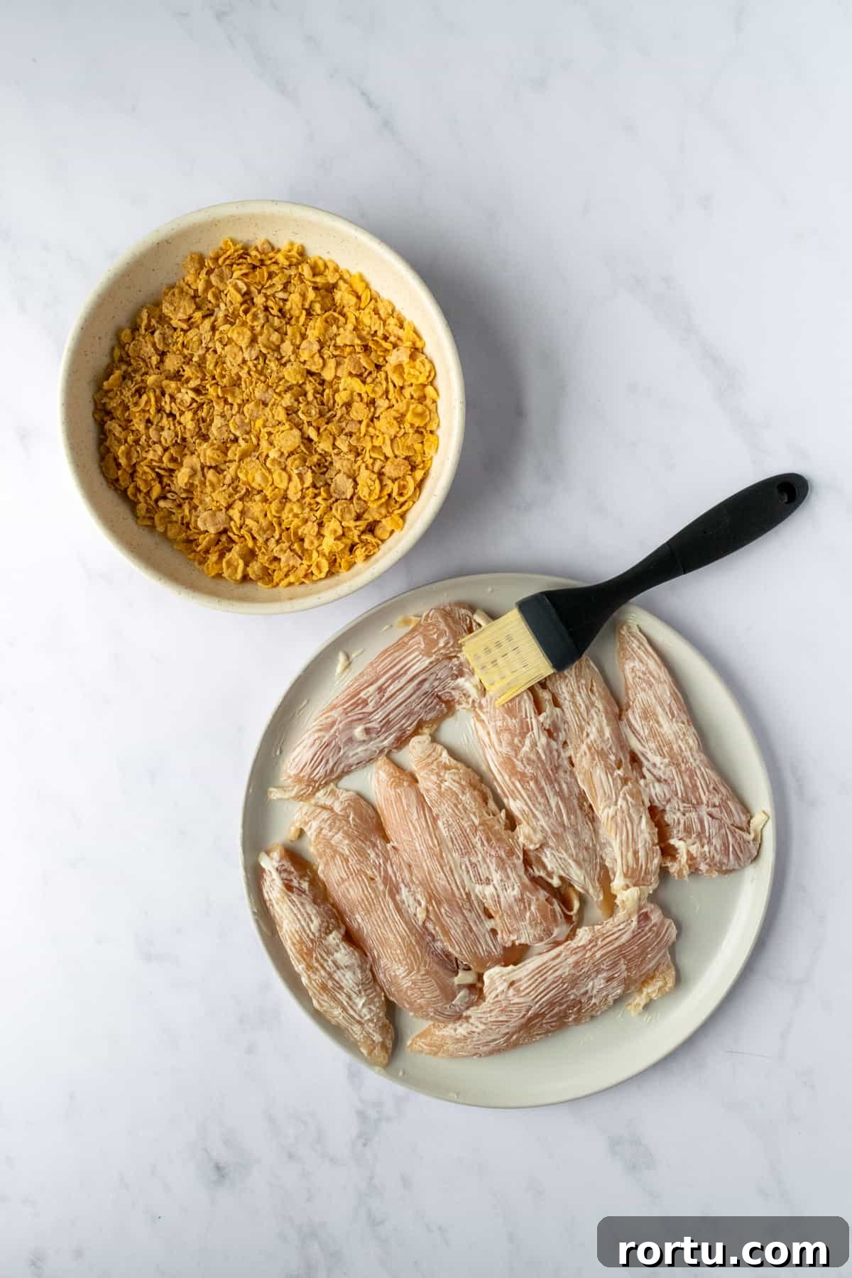 Crispy Baked Cornflake Chicken Tenders Recipe 4 Brush mayo over the chicken tenders before coating in crushed cornflakes.