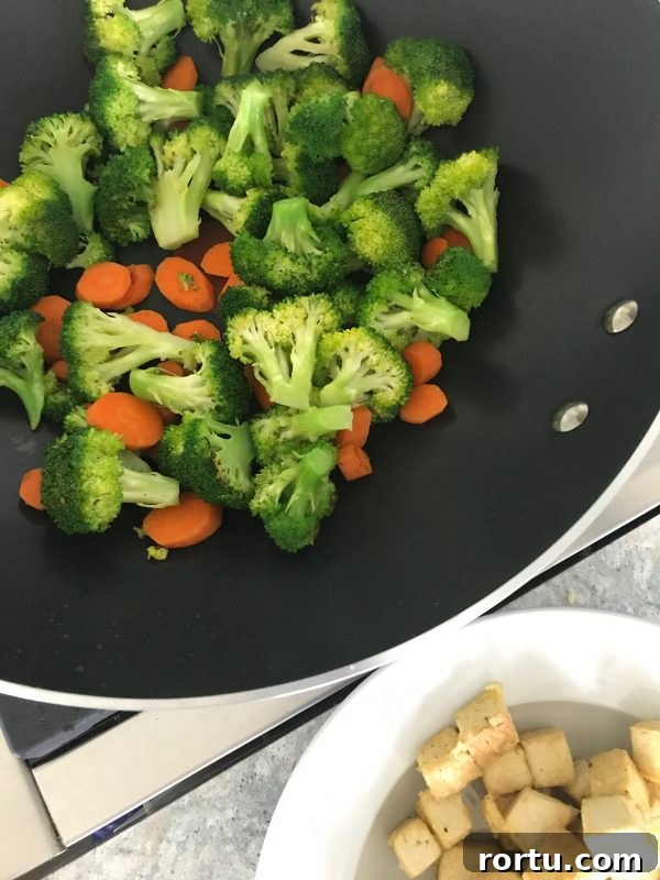 Tofu Stir-Fry With Broccoli and Carrots via LizsHealthyTable.com #familymealsmonth