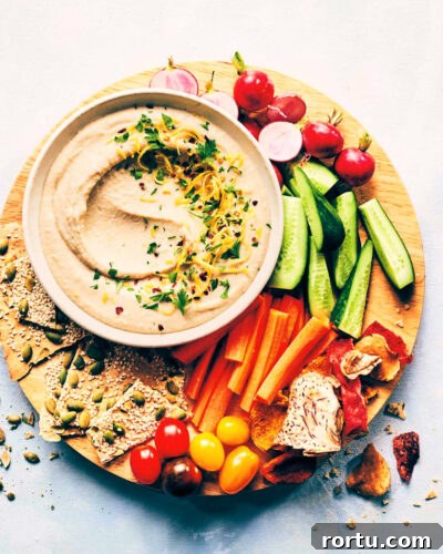 Platter with fresh veggies, crackers and white bean dip