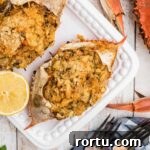 Close up of a stuffed crab with some boiled crabs on the outside.
