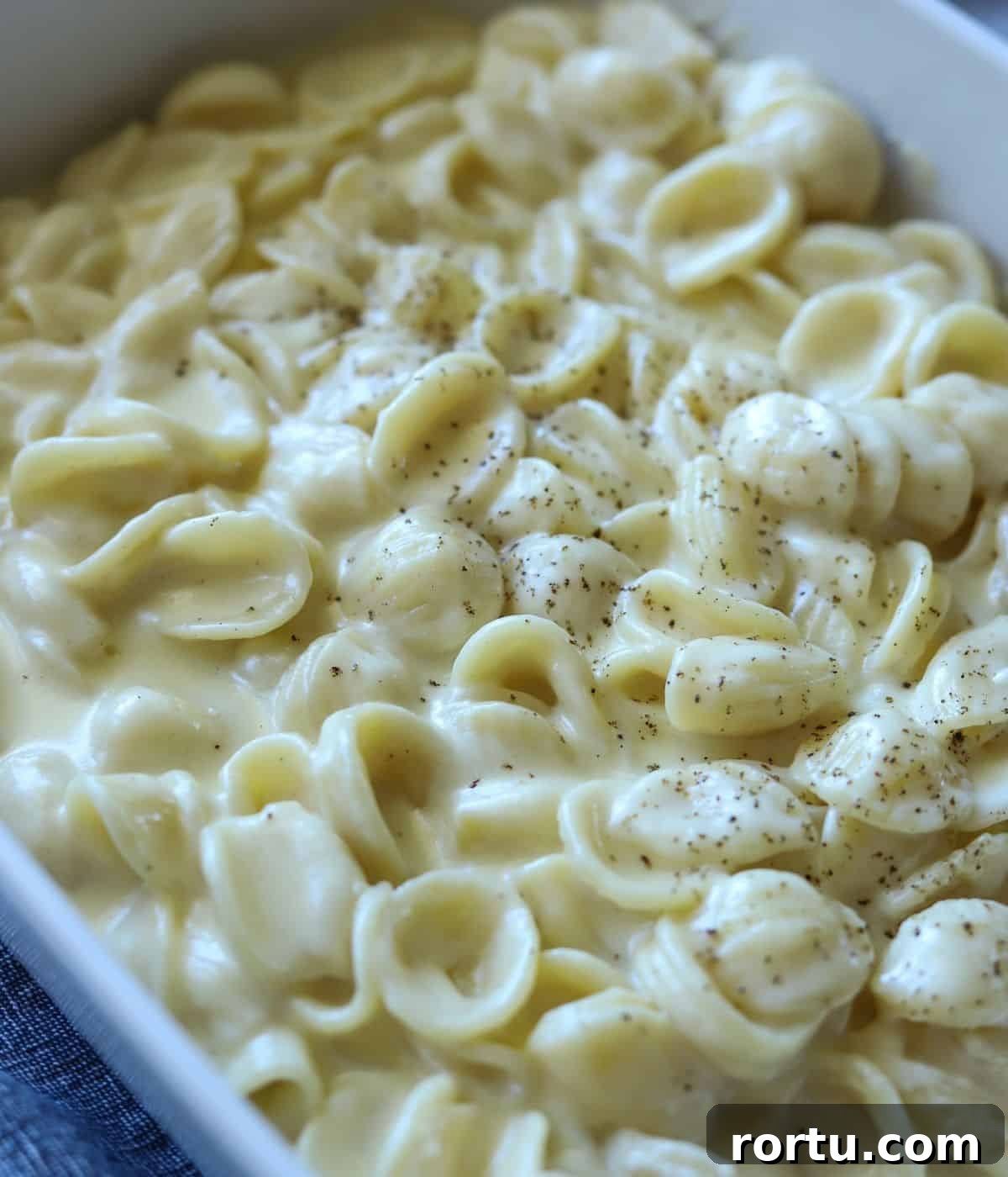 Creamy White Cheddar Macaroni and Cheese Recipe 2 close up of white cheddar macaroni and cheese in casserole dish