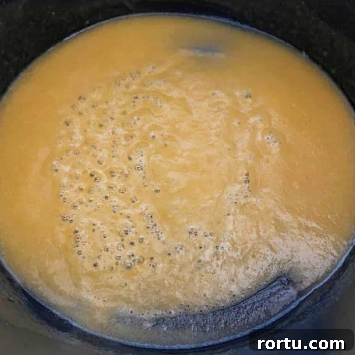 Creamy White Cheddar Macaroni and Cheese Recipe 5 Roux cooking in skillet.