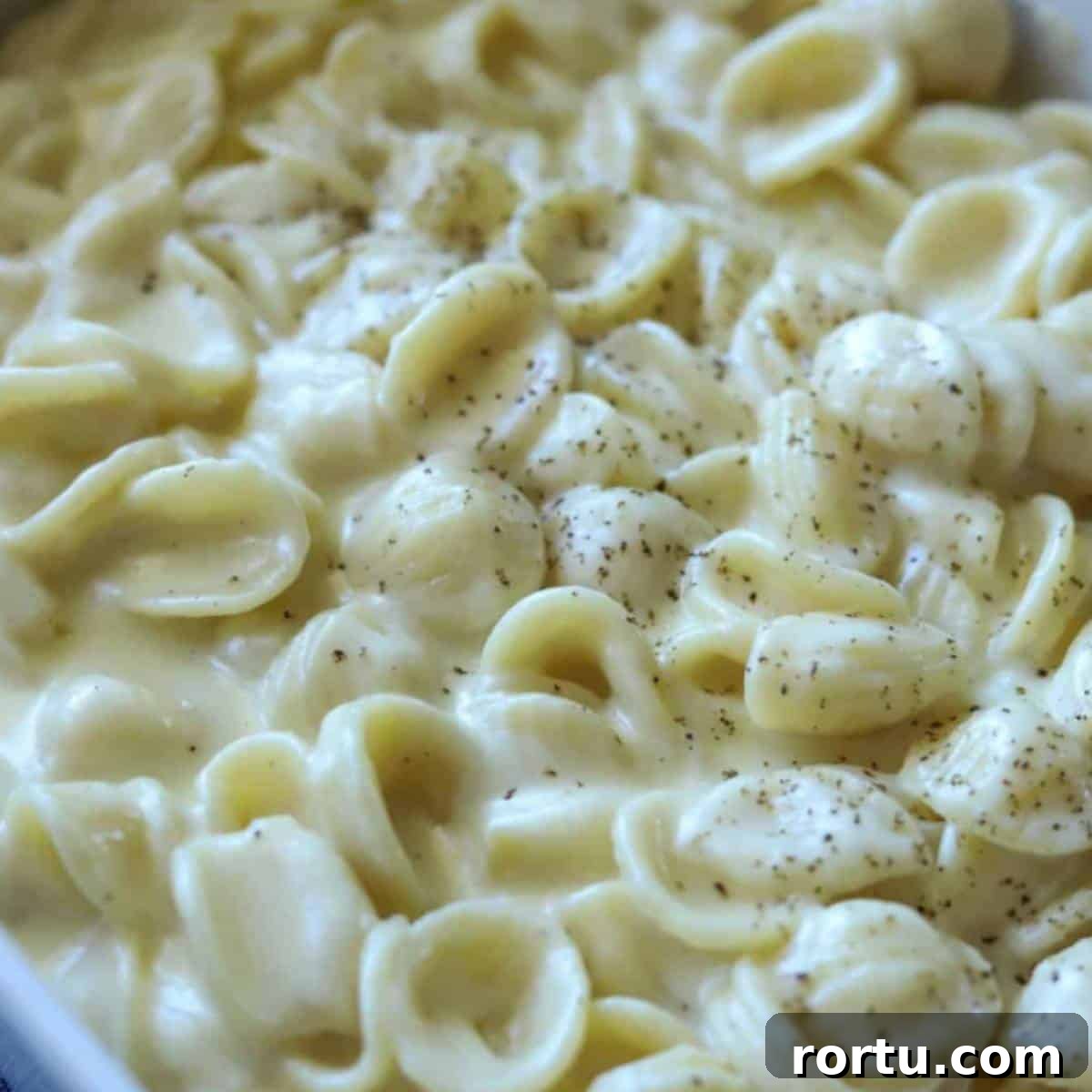 Creamy White Cheddar Macaroni and Cheese Recipe 9 White cheddar mac and cheese sprinkled with pepper.