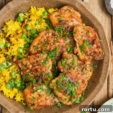 Square image of pan seared boneless chicken thighs.
