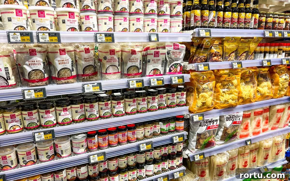 Photo of supermarket shelves filled with Thai condiments.