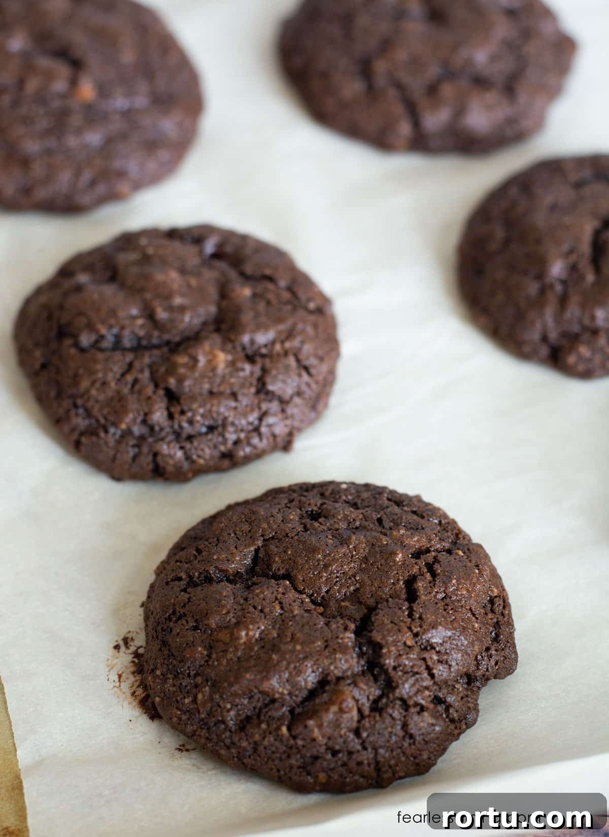 Baked gluten free cake mix cookies on a baking tray.