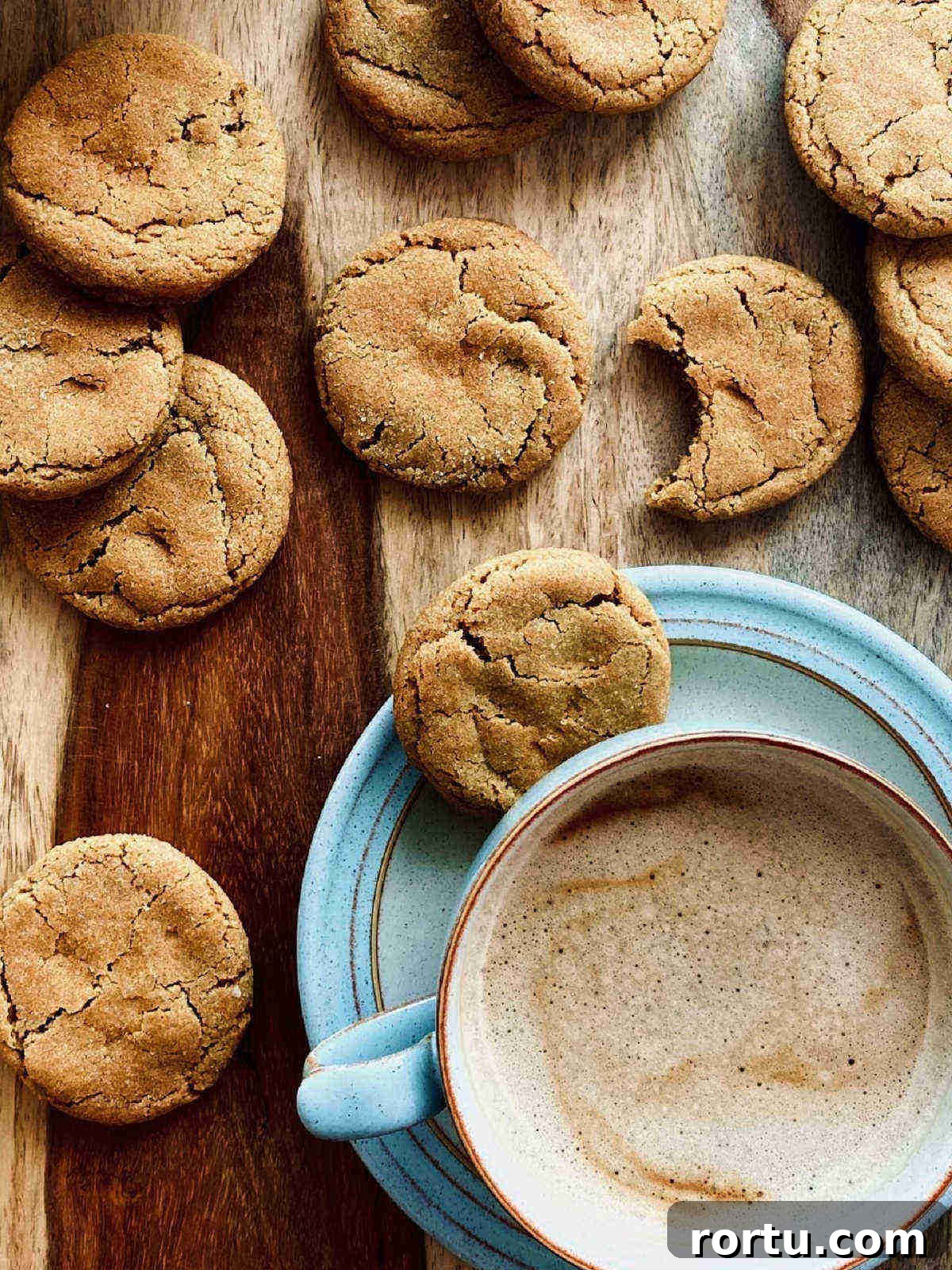 Soft Chewy Gingerbread Cookies Recipe for Holiday Baking 2 gingerbread cookies with coffee - portrait