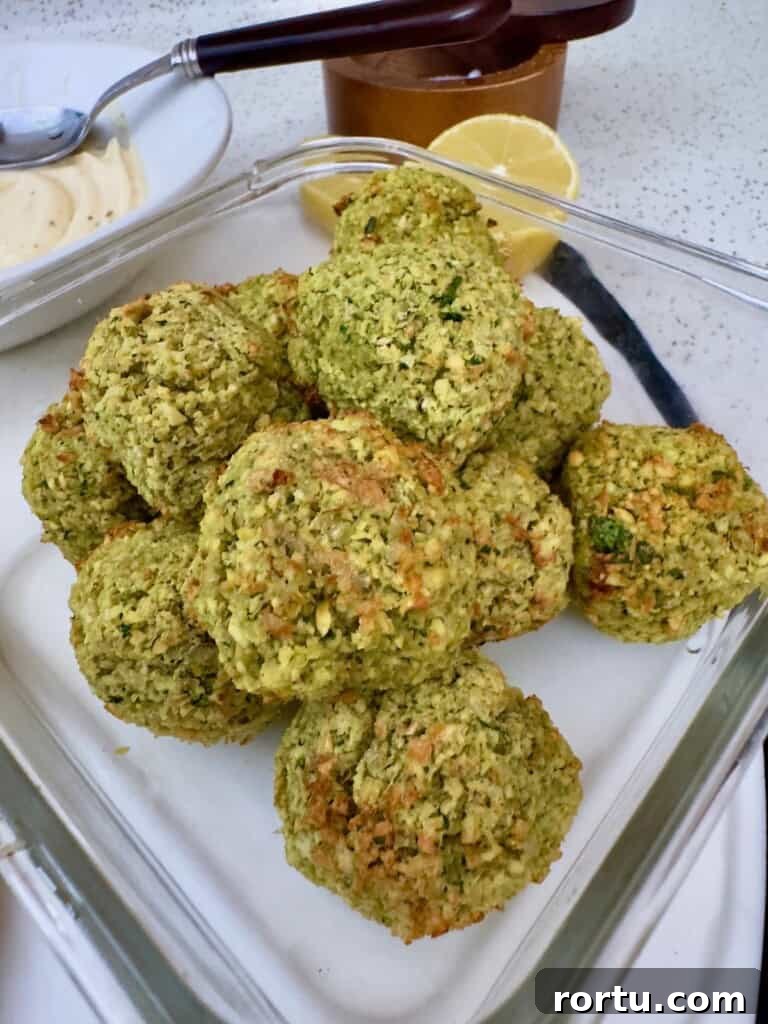 Close-up shot of crispy homemade falafel with fresh herbs.