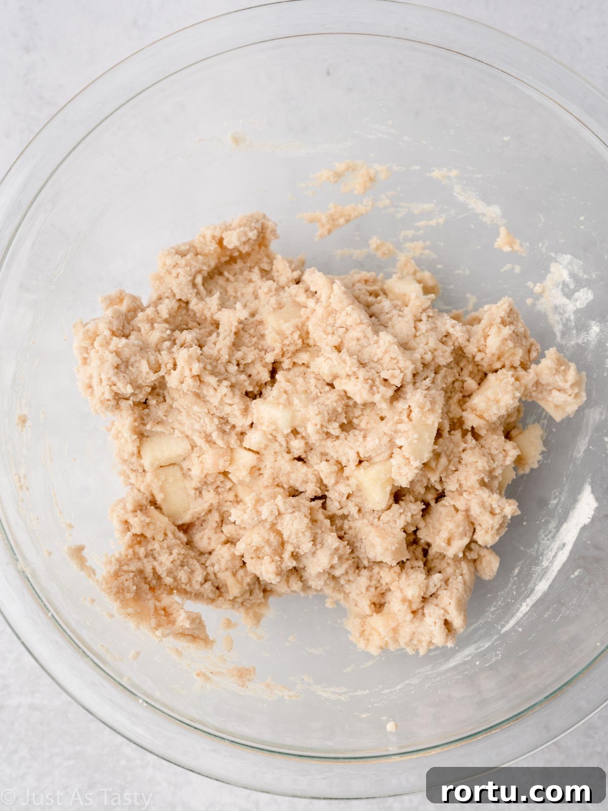 Apple fritter batter in a bowl.