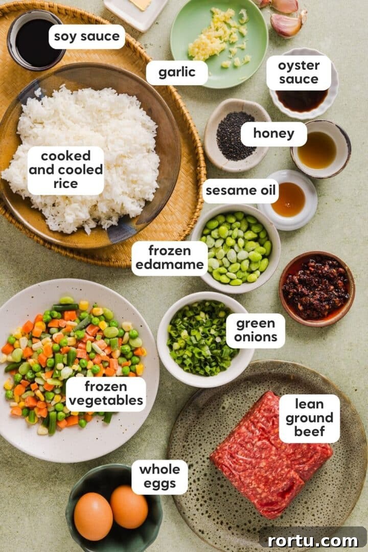 Savory Ground Beef Fried Rice Recipe for Weeknight Dinners 3 Labelled photo with ingredients for ground beef fried rice displayed in bowls on a green kitchen counter.