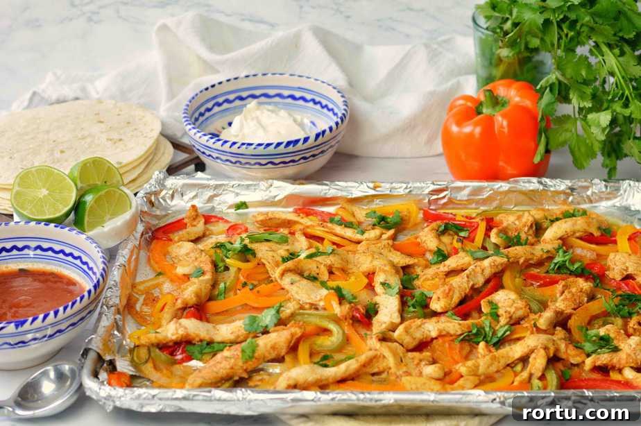 sheet pan full of cooked fajitas.title.