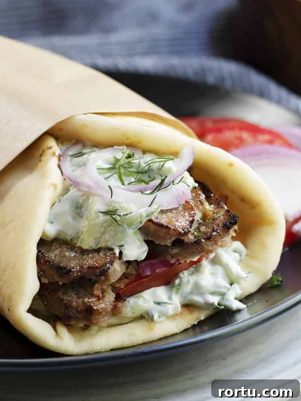 Lamb Ragu Recipe: Slow-Simmered Sauce with Parmesan 11 gyro served on a black plate