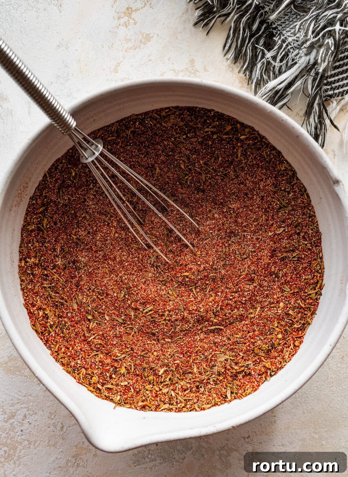 10-Minute Blackened Shrimp Recipe for Flavorful Weeknight Meals 7 bowl with a whisk and the blackened seasoning mixed together until combined.
