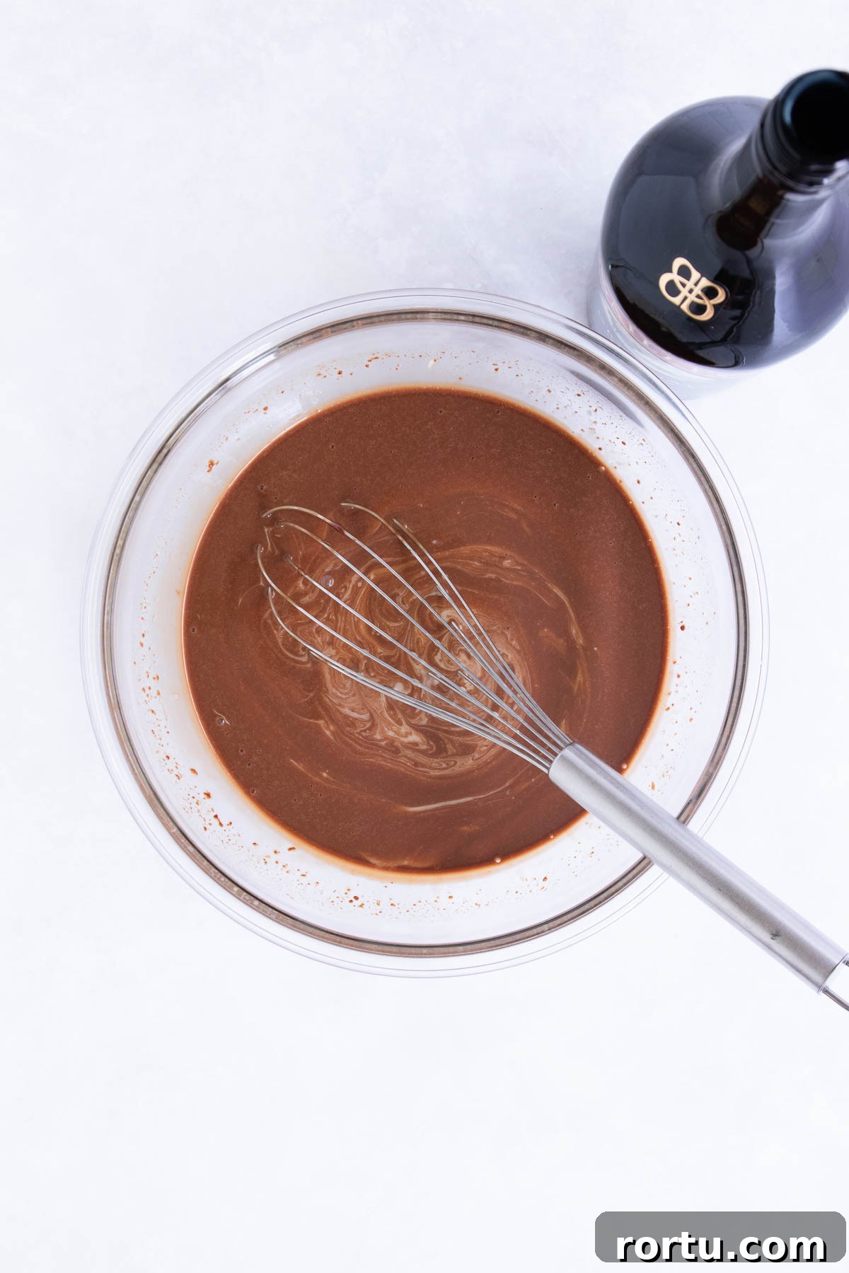 Creamy Baileys Chocolate Mousse Recipe 7 The Baileys Irish Cream being whisked into the chocolate and cream mixture.