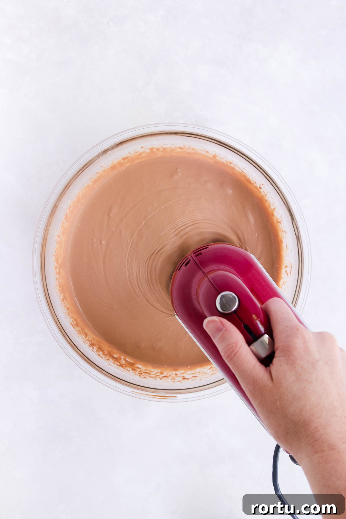 Creamy Baileys Chocolate Mousse Recipe 9 The mousse mixture being whipped with an electric hand mixer.