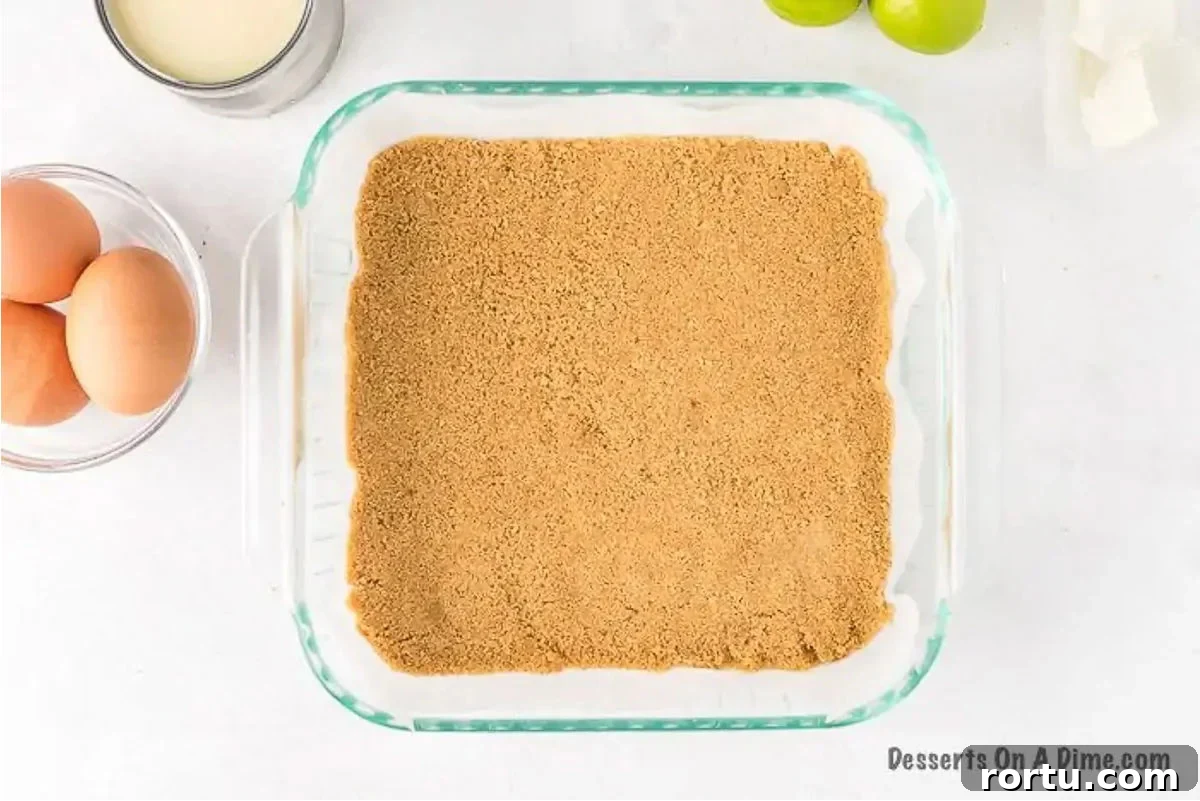 Graham crackers pressed into baking dish. 