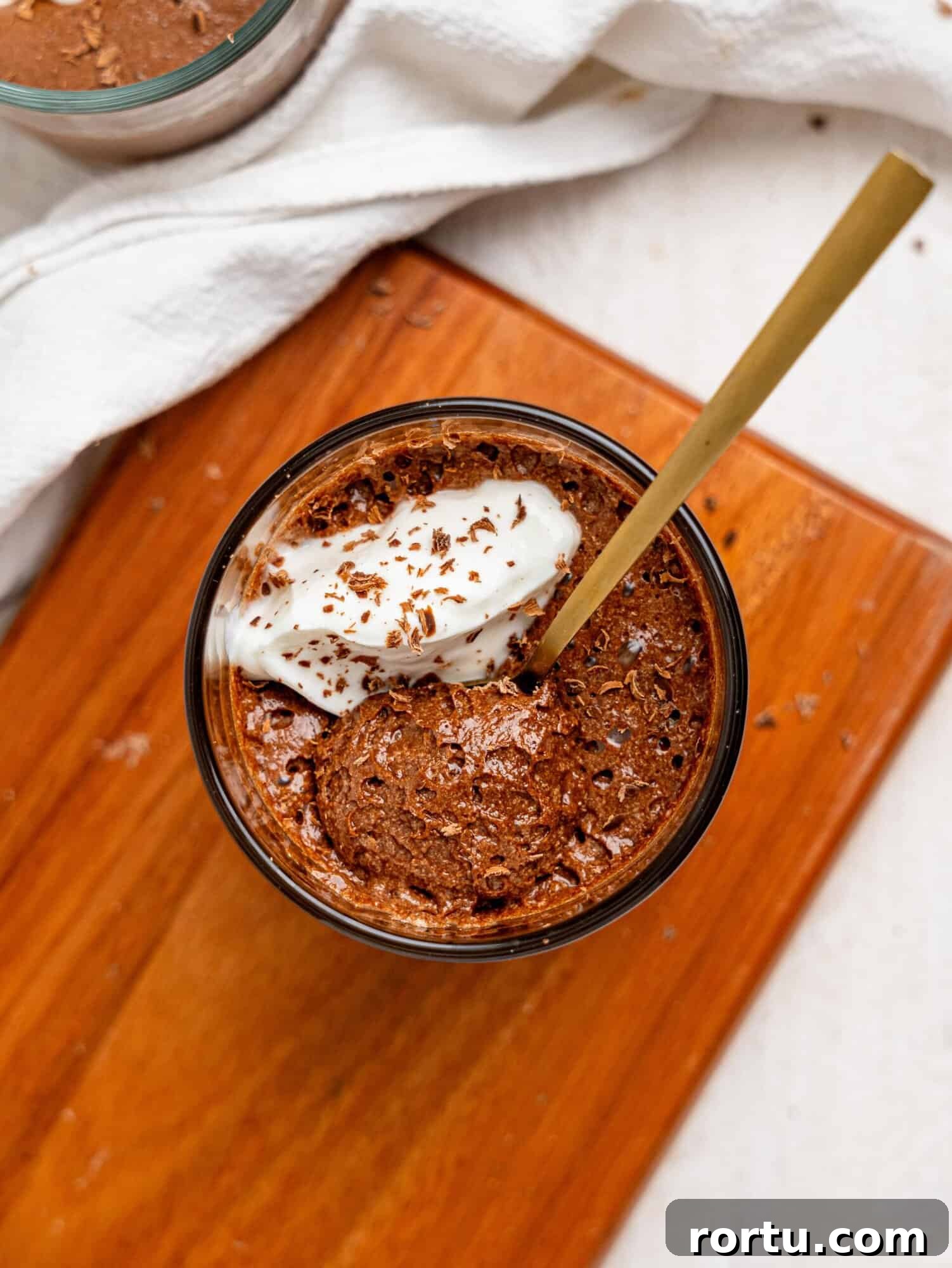 High-Protein Chocolate Mousse Recipe for Muscle Recovery 3 Bird's eye view of a spoon in protein chocolate mousse.