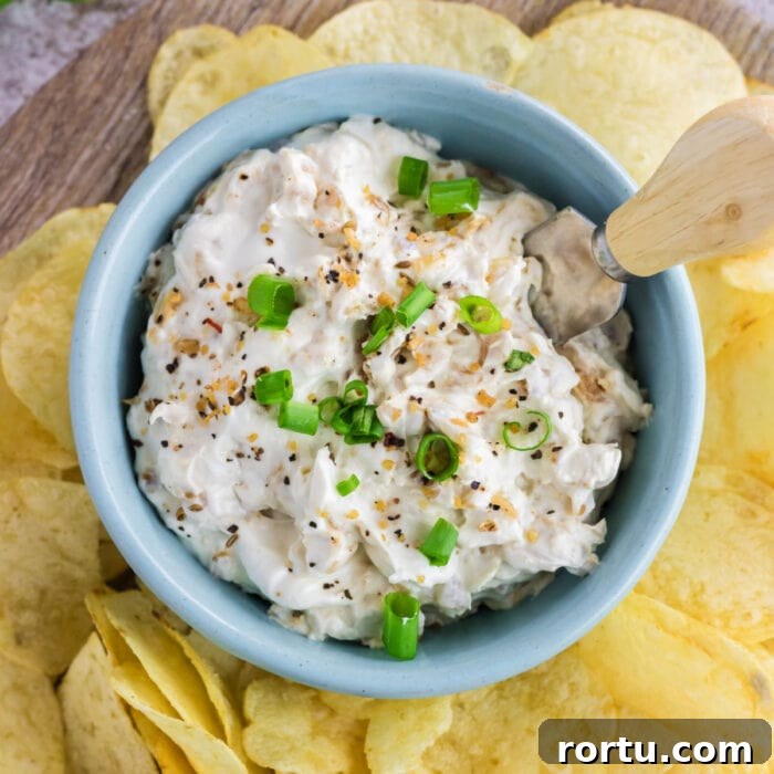 The Royal Coach Bread Bowl for Dip -> Royal Coach Bread Bowl Recipe for Party Dips 11 Overhead view of onion dip in a blue bowl.