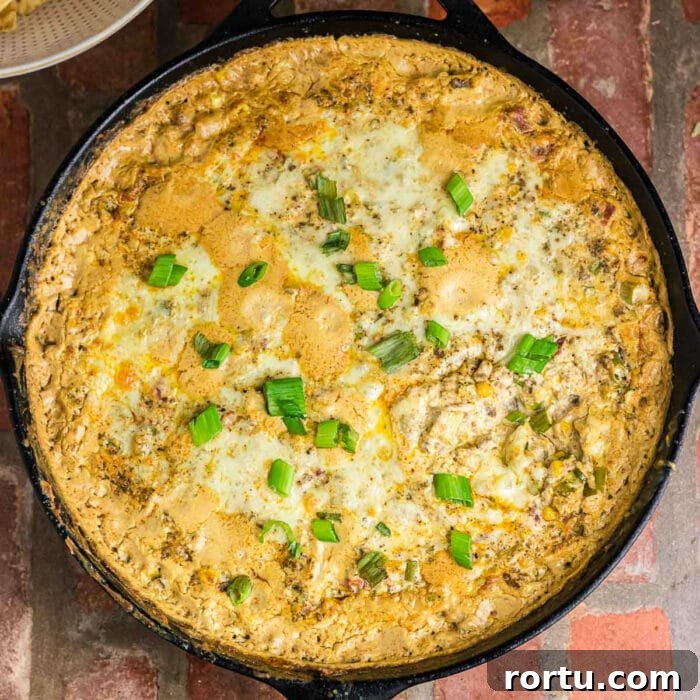 The Royal Coach Bread Bowl for Dip -> Royal Coach Bread Bowl Recipe for Party Dips 12 Overhead view of baked cowboy dip in an iron skillet.