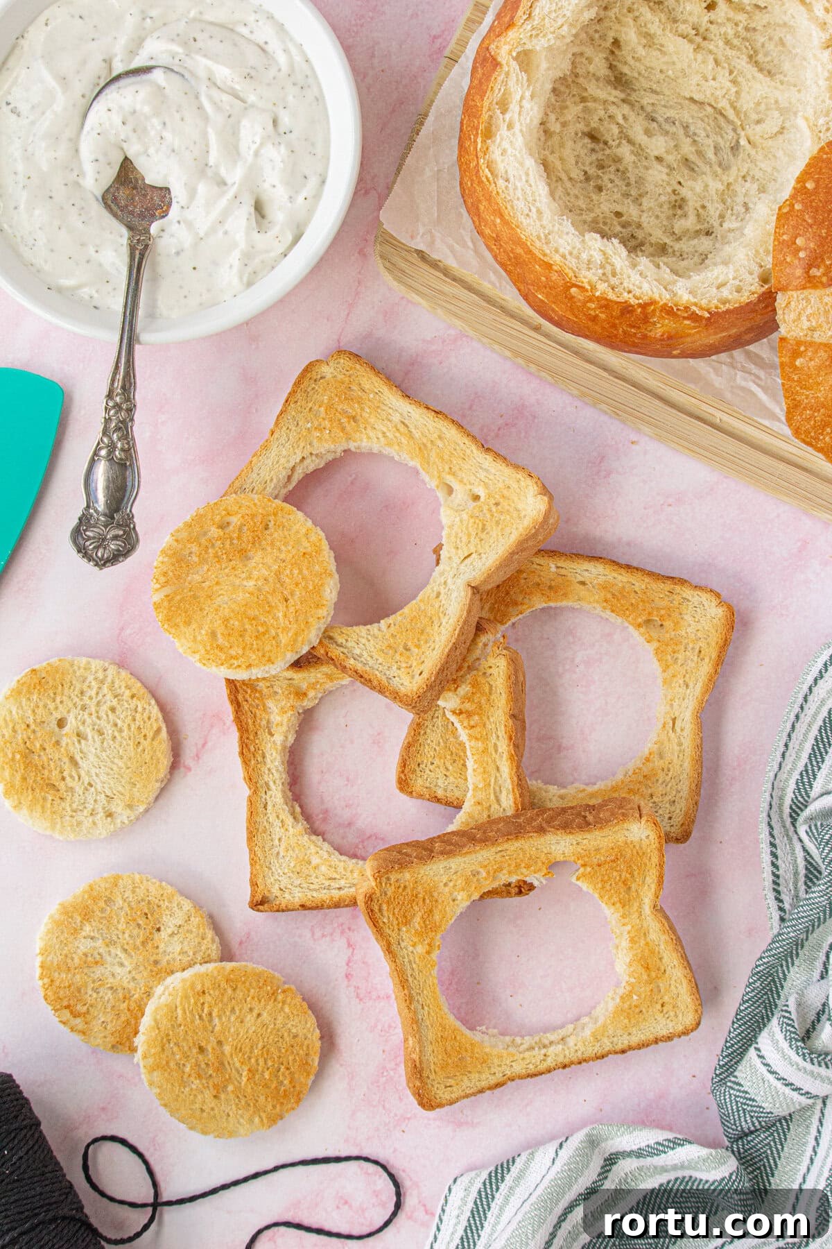The Royal Coach Bread Bowl for Dip -> Royal Coach Bread Bowl Recipe for Party Dips 5 Overhead view of the toast cut into circles for the wheels.
