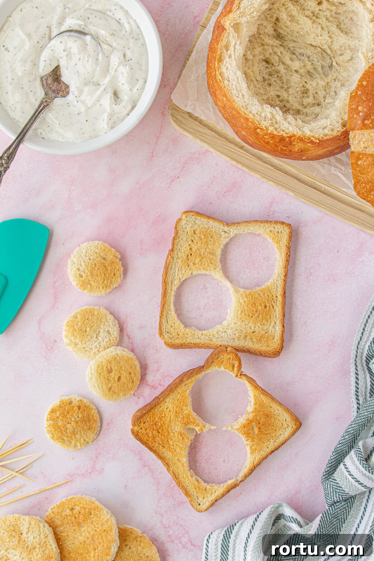 The Royal Coach Bread Bowl for Dip -> Royal Coach Bread Bowl Recipe for Party Dips 6 Overhead view of the smaller circles cut for the hubs of the wheels.