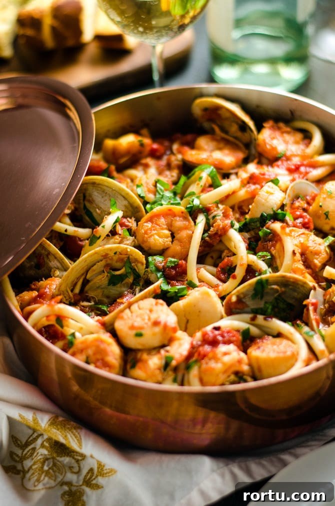 Seafood Fra Diavolo. This pasta dish is impressive for a date night or Valentine's Day dinner but easy enough to make at home! Loaded up with shrimp, scallops, clams, and crab, it doesn't get better than this. | hostthetoast.com