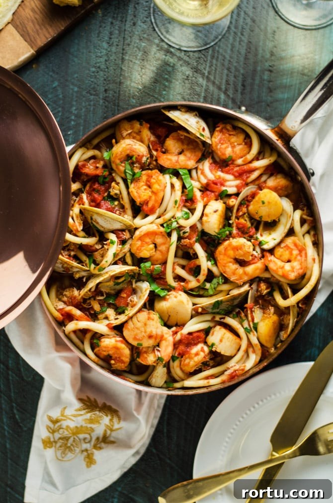 Seafood Fra Diavolo. This pasta dish is impressive for a date night or Valentine's Day dinner but easy enough to make at home! Loaded up with shrimp, scallops, clams, and crab, it doesn't get better than this. | hostthetoast.com