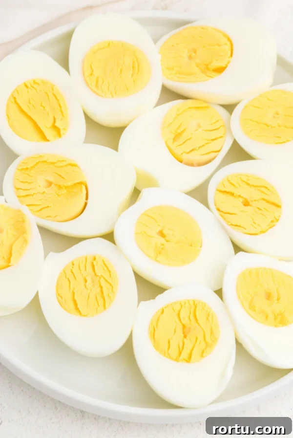 Plate full of air fryer hard boiled eggs cut in half.