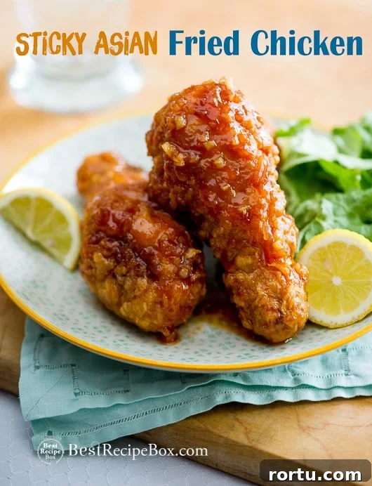 Amazing Asian Fried Chicken Recipe with Garlic Chili Sauce on a cutting board 