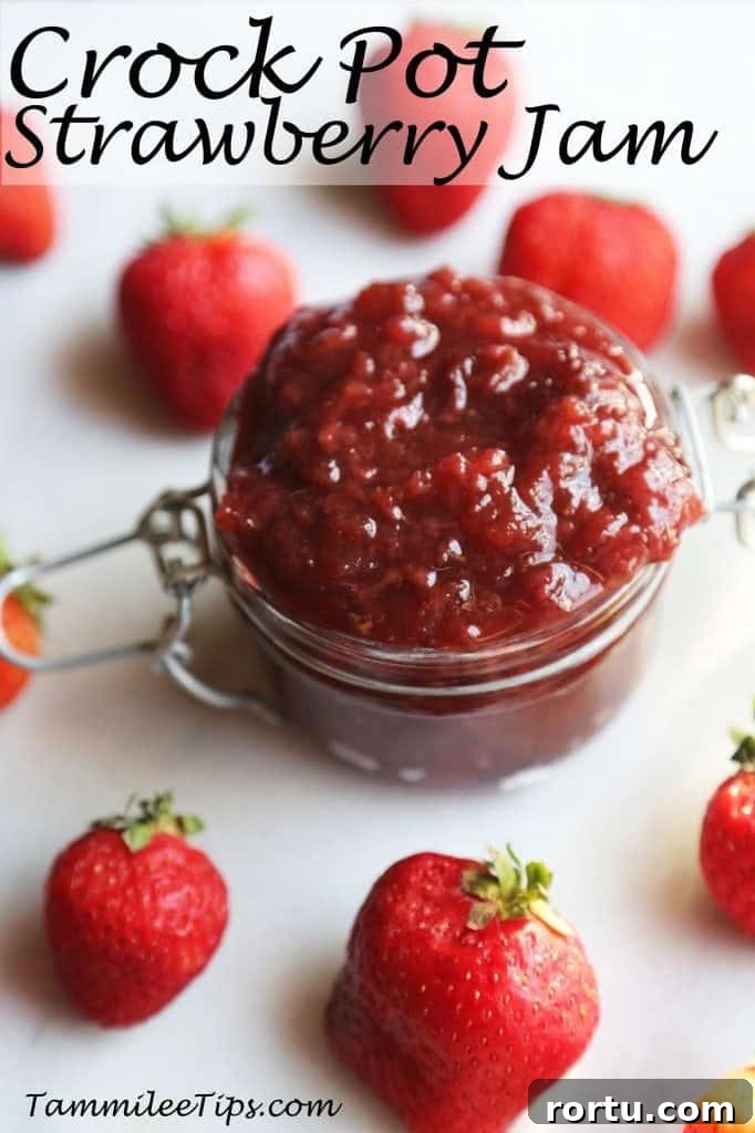 Crockpot Strawberry Jam text printed over a glass jar with jam and fresh strawberries