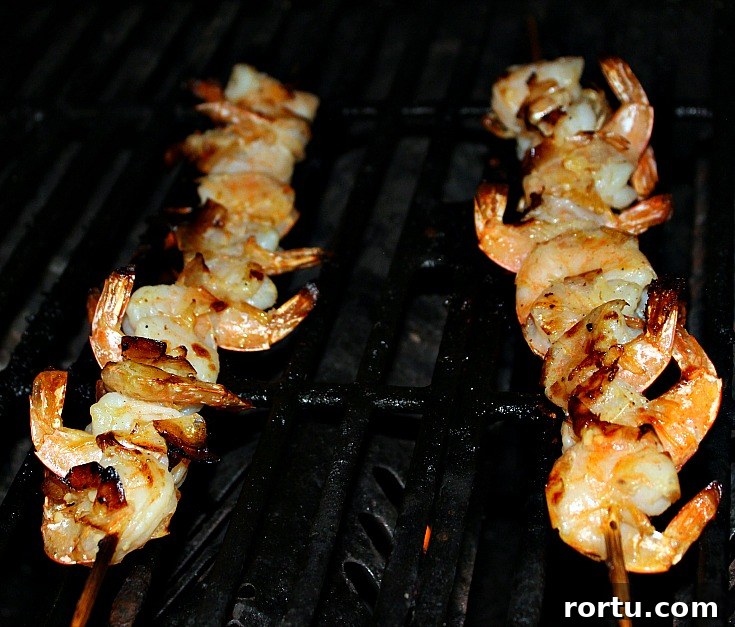 Garlic Butter Grilled Shrimp Skewers cooking on grill